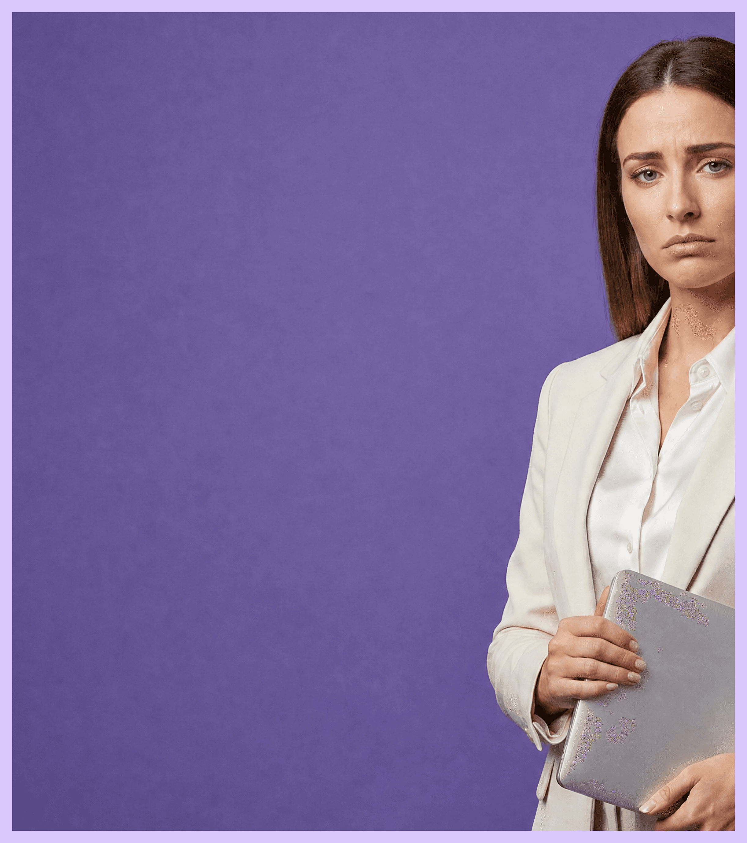 Frowning woman in a cream blazer holding a closed silver laptop.
